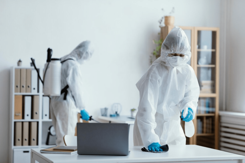 Workers conducting disinfection in an office